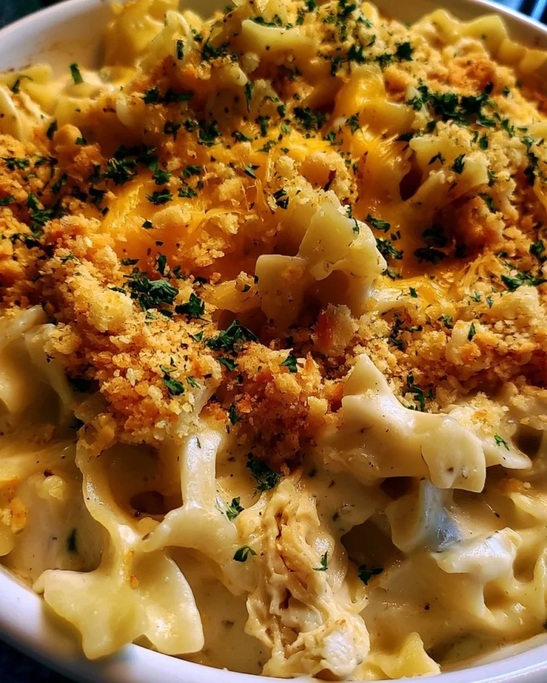 Dolly's creamy chicken noodle casserole served in a baking dish with a golden crust.